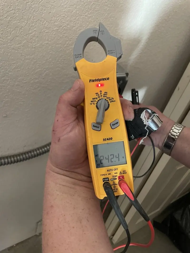 Voltage testing with clamp meter during Outlet Installation in Chesterton